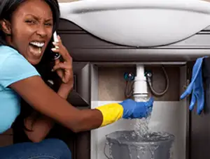 Emergency plumbing repair for a leaking sink drain under a bathroom vanity in Columbus, OH