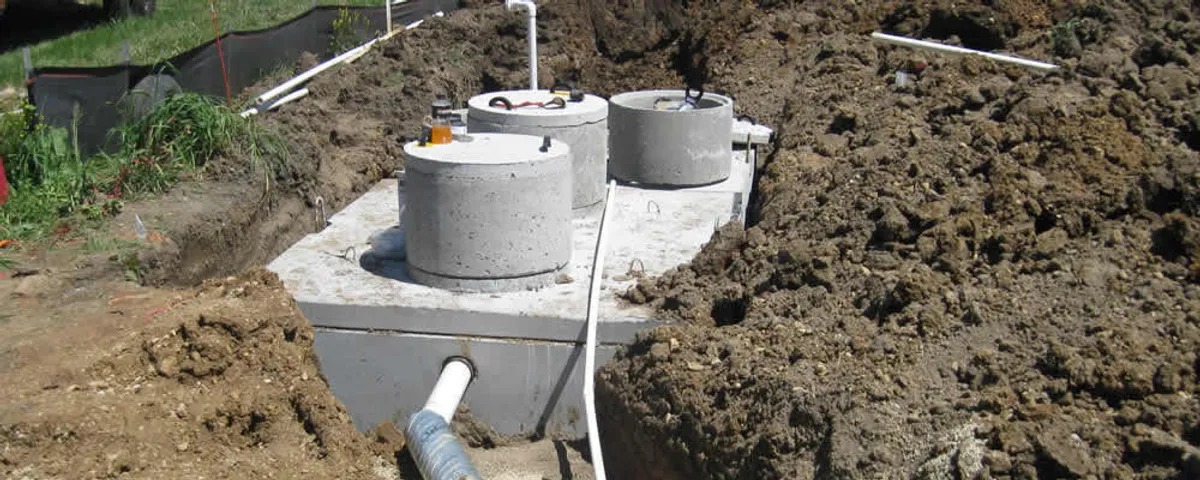Septic system repair and installation site with tank access ports in Columbus, OH