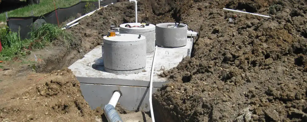 Septic system repair and installation site with tank access ports in Columbus, OH